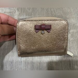 NWOT Kate Spade rose gold wallet.